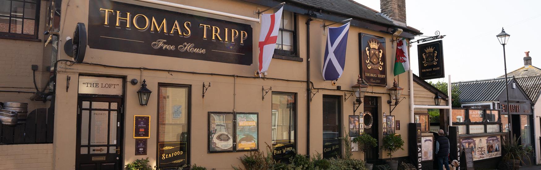 Exterior shot of the Thomas Tripp pub in christchurch with the rugby six nations flags handing up