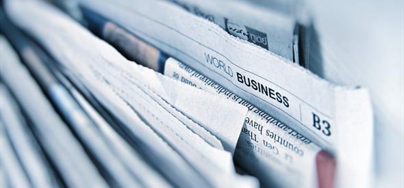 newspapers in a stack.