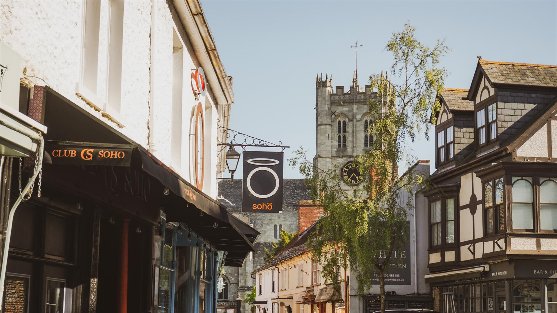 Shot looking down highstreet with priory in the background