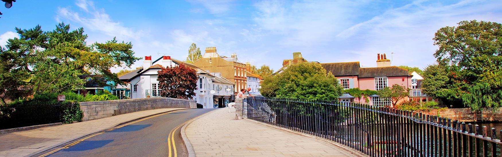 Lovely shot of a Christchurch road over the bridge leading into the town on a sunny day