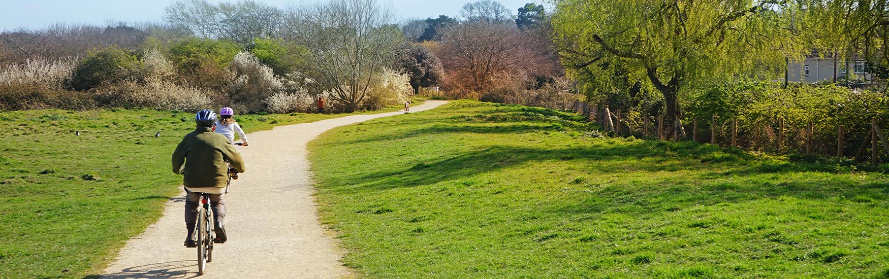 Two people enjoying a leisurely bike ride through the Christchurch countryside