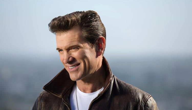 Chris Isaak smiling
