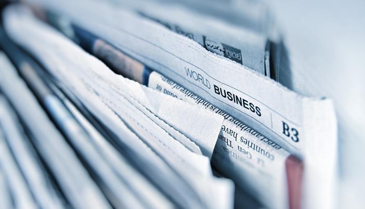 newspapers in a stack.