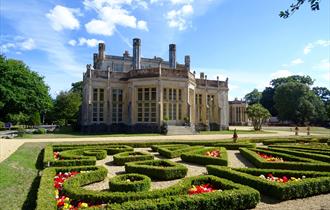 Castle on sunny day with Parterre hedge in the foreground