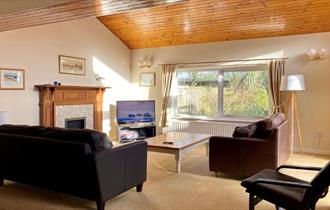 Warm, modern and cosy interior of chalet with wooden details