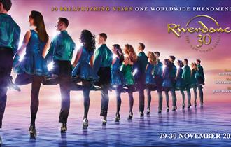 Riverdance group in a line looking away from the camera