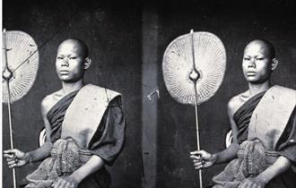 an old photograph taken by John Thompson of two young guys