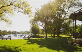 The quay in bright daylight with the bandstand at the side.