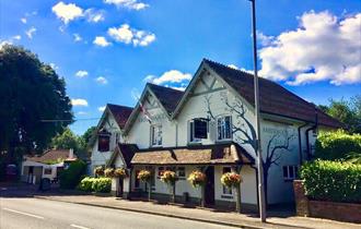 Front side of the Amberson Inn on the side of the road.