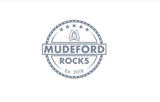 Circular mudeford rocks logo on white background.