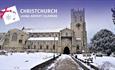 Christchurch Priory in the snow with CLAC logo
