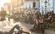 Man pulling up to the bike night event in Poole Quay