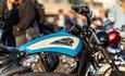 Close up of Blue moterbike with crowds looking