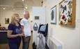 Couple looking at a wall paintings
