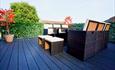 Outdoor seating area with wooden flooring