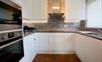 Light modern kitchen with appliances