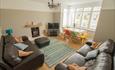 Inviting and colourful lounge with TV and sofas