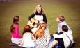 Maria sat singing with the Von Trapp children in the sound of music musical