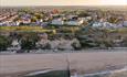 Cliff top view with properties by the sea