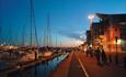 Poole quay lit up at dusk