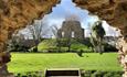The Castle Ruins photographed through a doorway of the Norman House.
