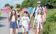 Family walking with their nets to pond dipping