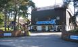 Exterior shot from the road of the huge snowtrax logo on the side of the slopes