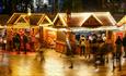 Long exposure of the Bournemouth Christmas markets and visitors shopping at the man stalls in the Square