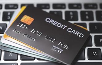 Generic stock image of bank credit card on laptop