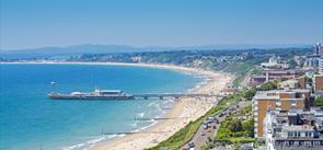 Shot of Bournemouth Pier taken from the cliff tops overlooking the beach