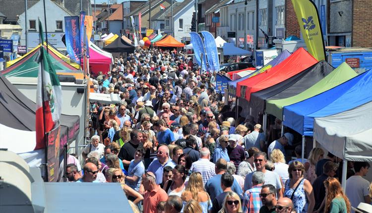 High Street, Highcliffe showing trade stalls and festival visitors