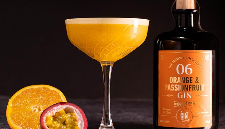 Gin festival promo images featuring bottle and glass of Orange & Passionfruit Gin