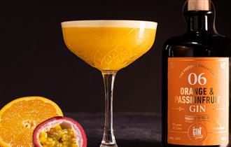 Gin festival promo images featuring bottle and glass of Orange & Passionfruit Gin