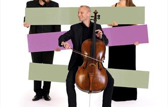 Image of 3 BSO musicians, one playing a cello