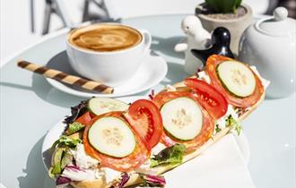 yummy looking coffee and open sandwich.