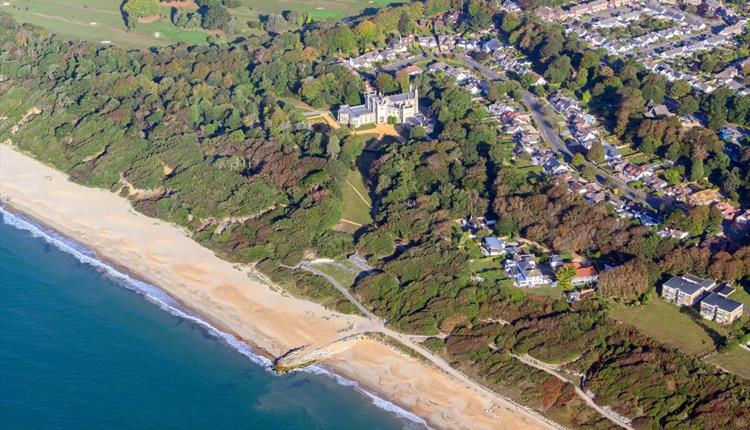 Arial view of Highcliffe beach with the castle sat in the background