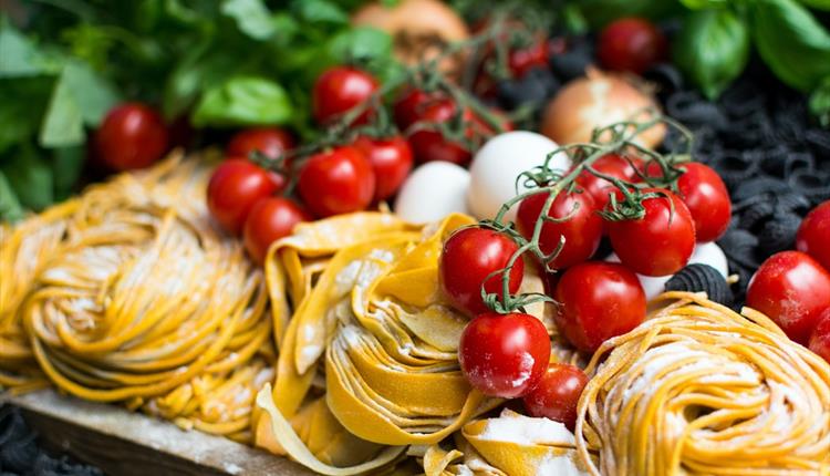 Italian food: vine tomatoes, fresh pasta, mozzarella and basil.