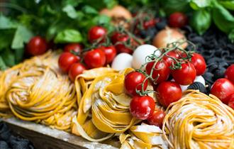 Italian food: vine tomatoes, fresh pasta, mozzarella and basil.
