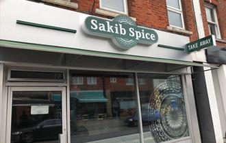 Sakib spice outside of restaurant.