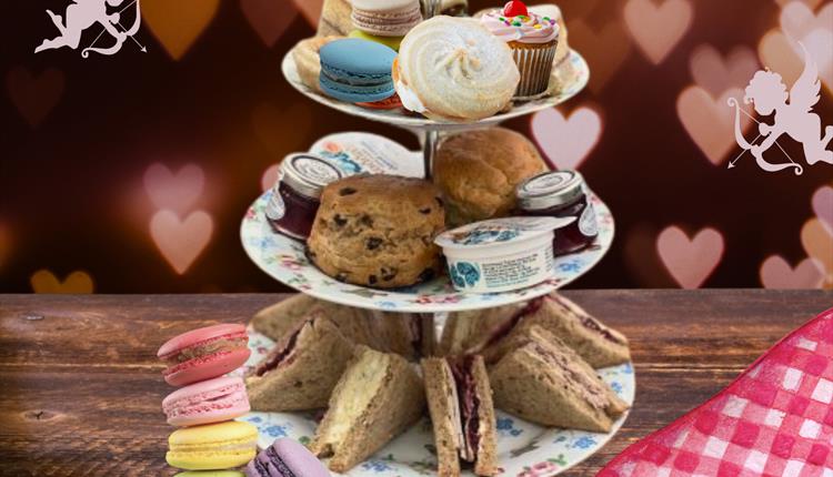 tea tray with sandwiches, scones, and sweets