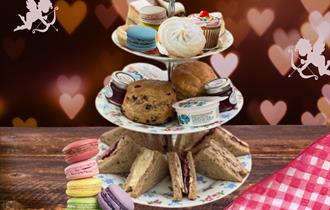 tea tray with sandwiches, scones, and sweets