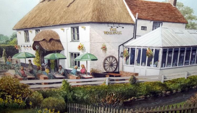 painting of people enjoying the Woolpack on a warm sunny day.